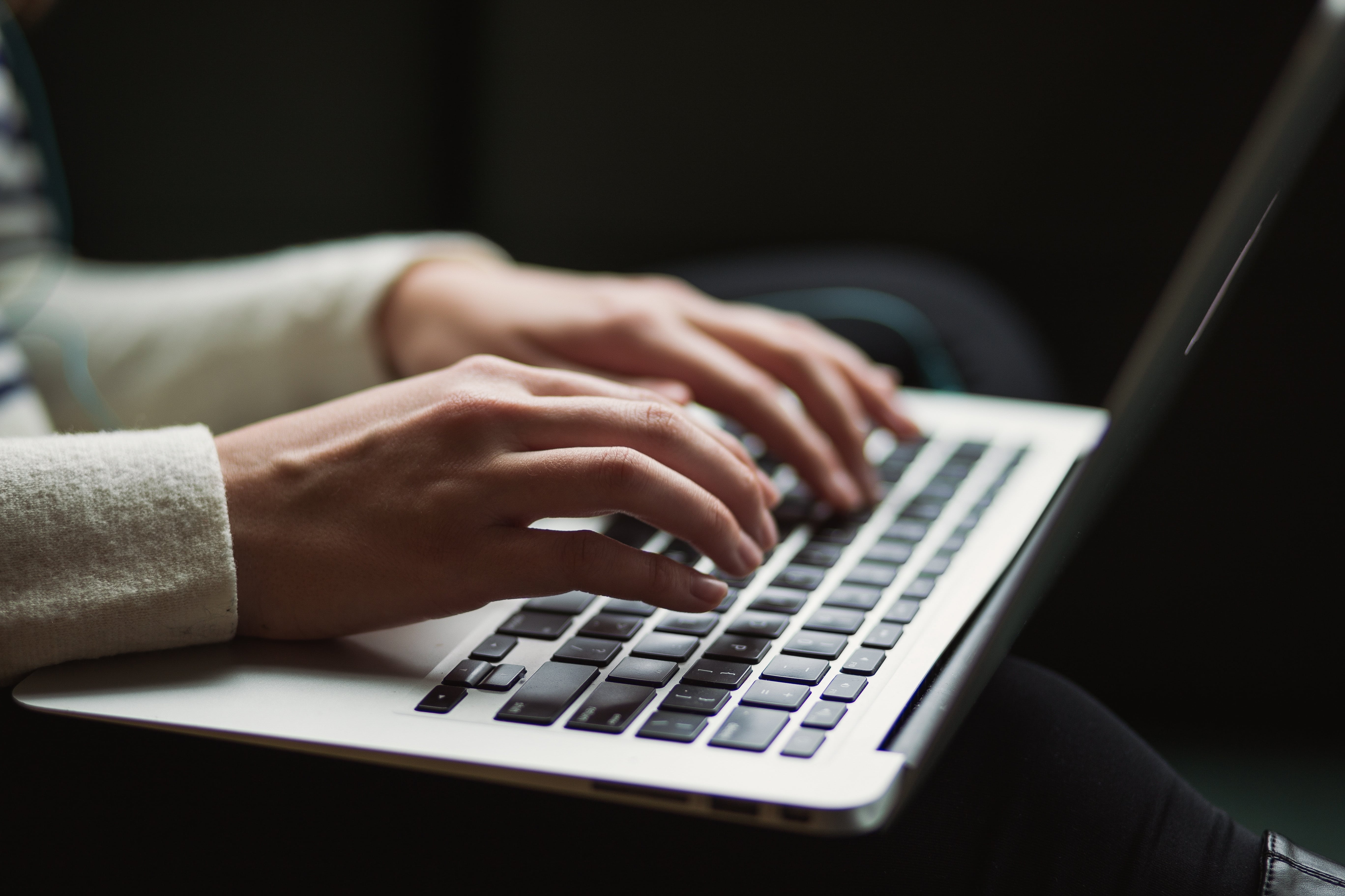 person typing on a computer