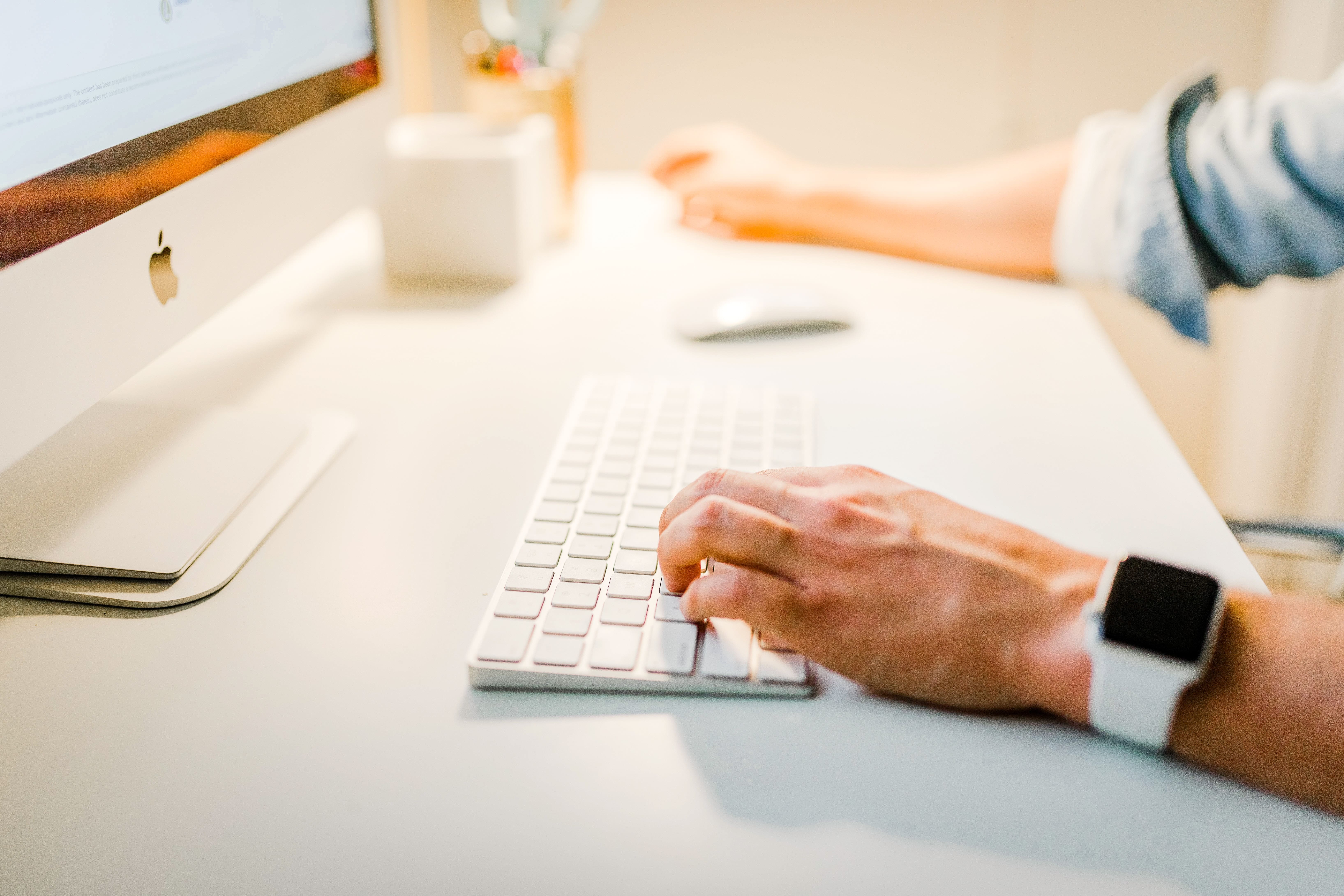 person using Mac computer